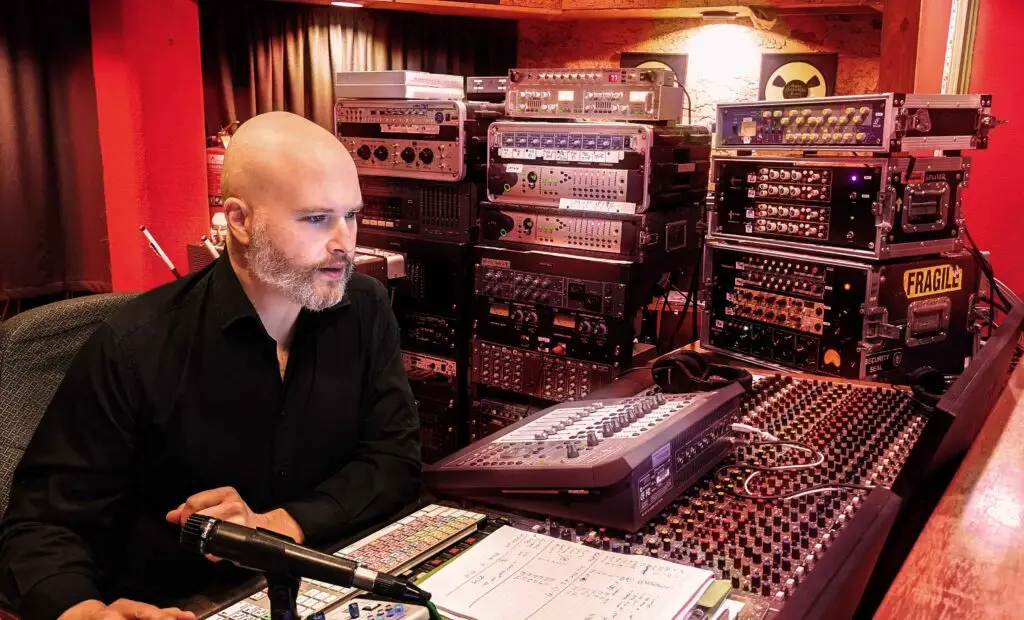 Melbourne based Producer Engineer Daniel Jason Booth in the studio surrounded by analog equipment