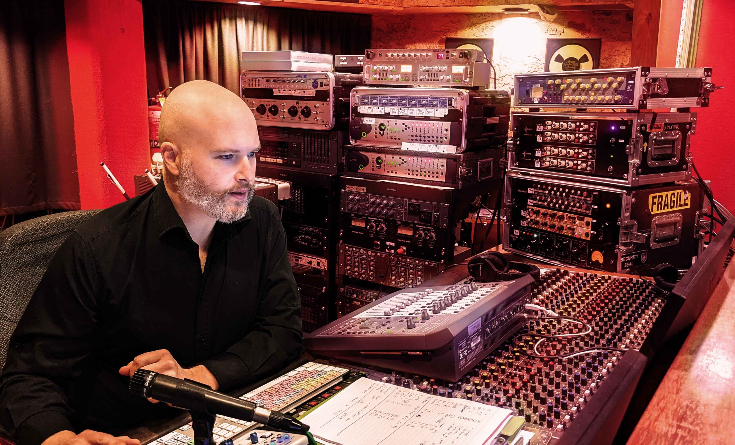Melbourne based Producer Engineer Daniel Jason Booth in the studio surrounded by analog equipment